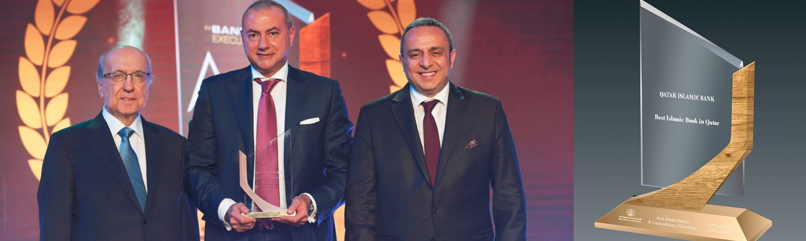 Photo showing group chief executive receiving award.