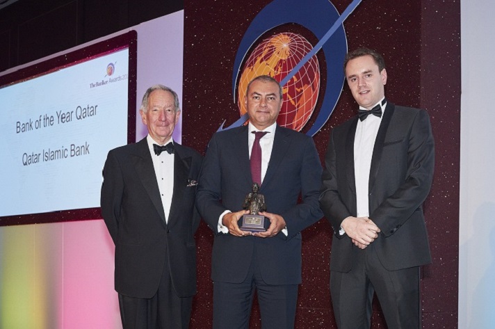 Photo showing executive receiving banking industry award.