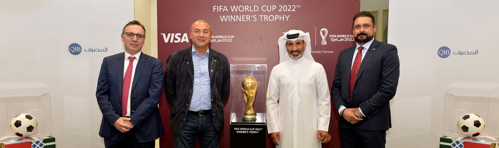 Promotional banner featuring World Cup trophy graphic and partnership messaging.