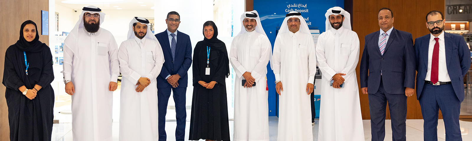 Team photograph of staff members posing indoors following a recognition event.