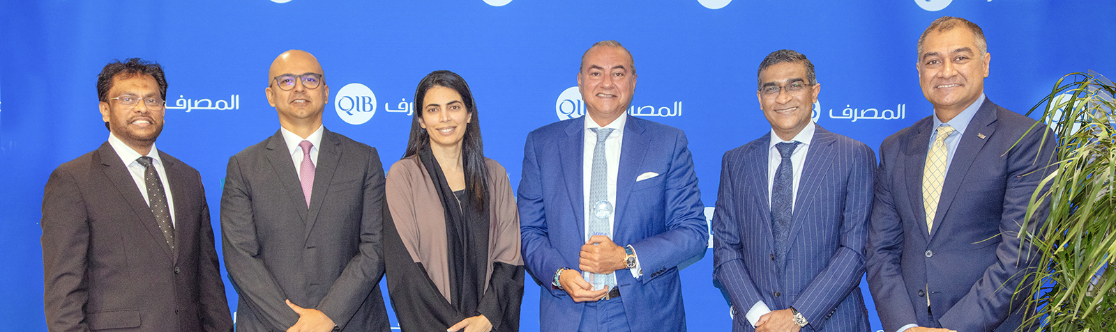 Banner announcing sustainability award recognition for banking performance in Qatar.