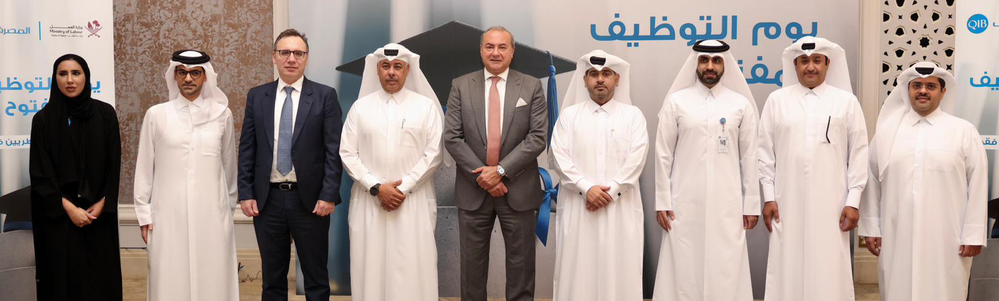 Group of executives standing side by side indoors during an official meeting.