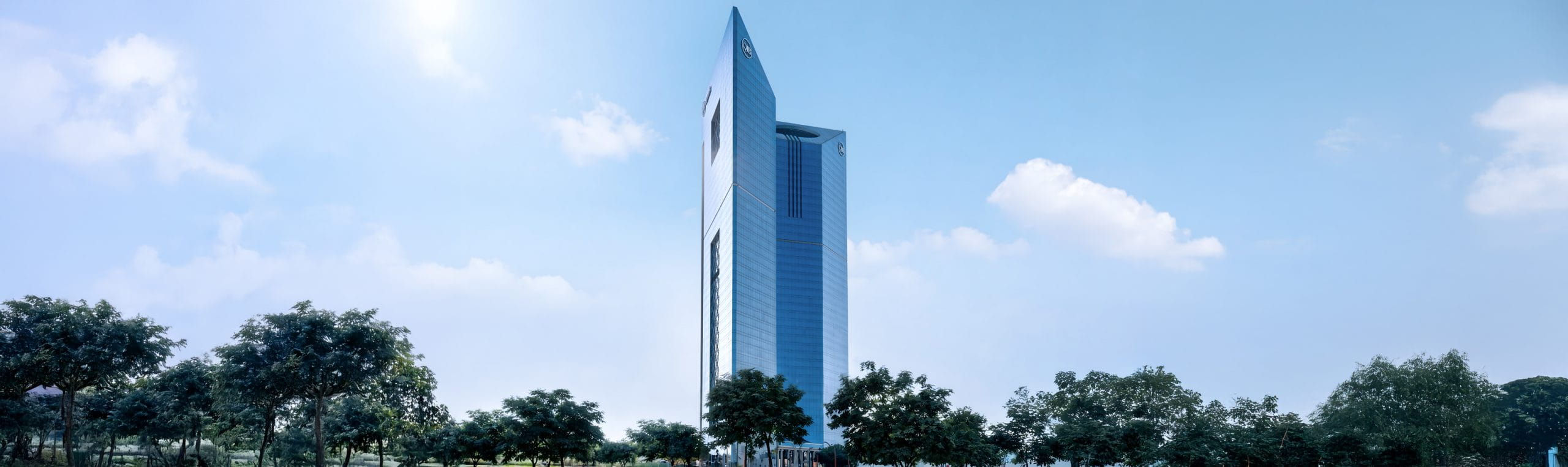 Hero banner showing Qatar Islamic Bank headquarters building exterior